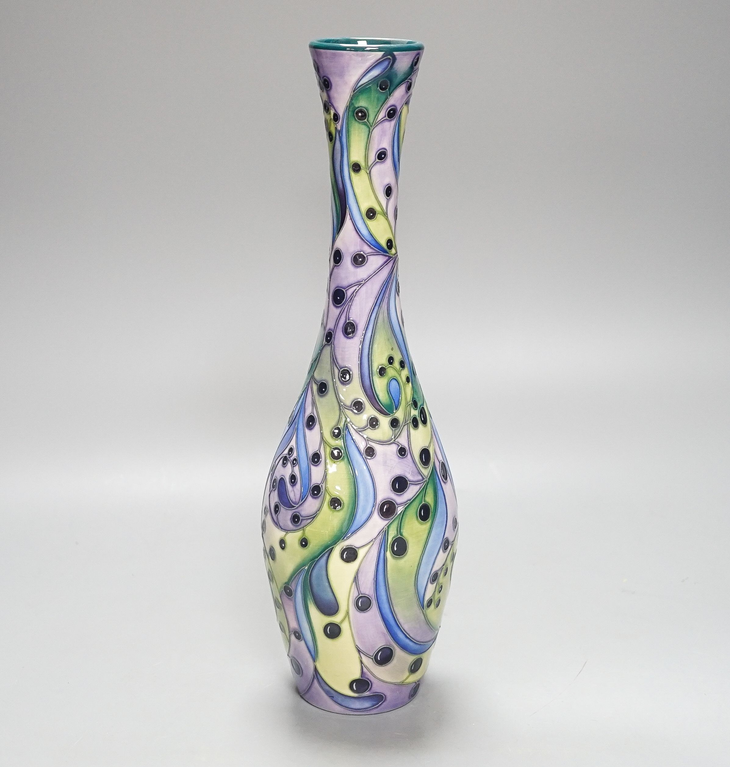 A Moorcroft bottle vase, stylised berries 31cm